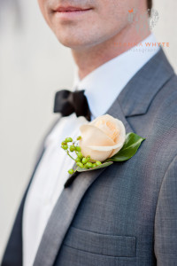 Groom boutonniere. Rose with Berry feature